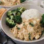 Crockpot smothered chicken with a side of rice and broccoli.