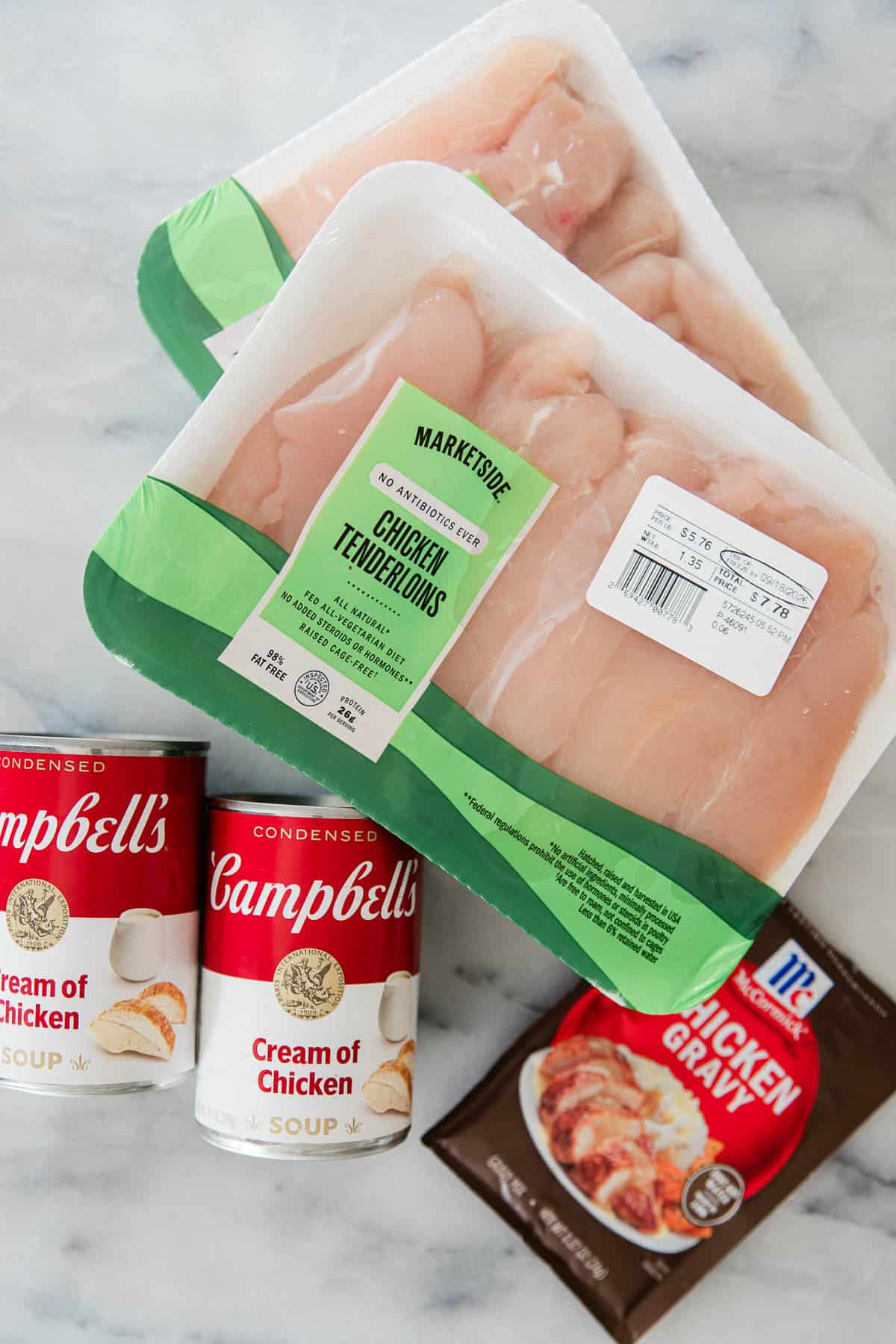 Ingredients to make this slow cooker smothered chicken on a table.