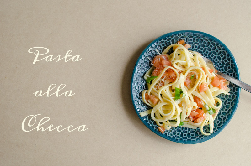An overhead shot of pasta all checca with text written at the side
